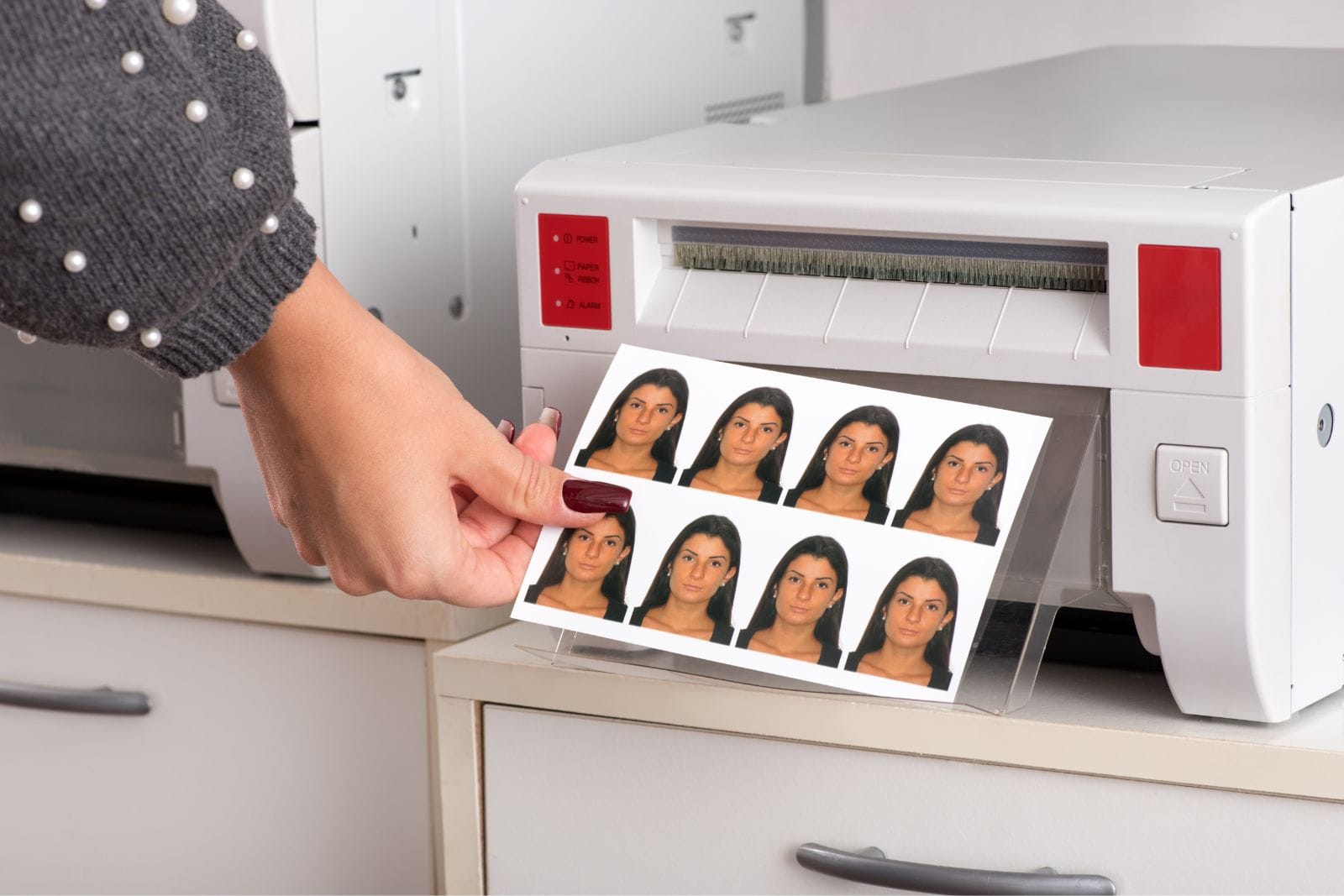 staff printing passport photos
