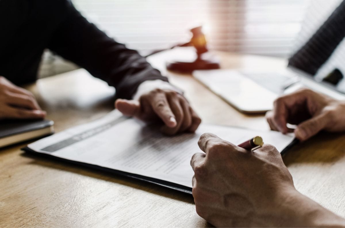 staff showing client a form